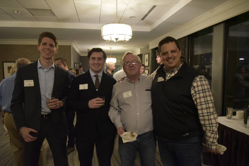 Four Seidman alumni reconnecting at the event.